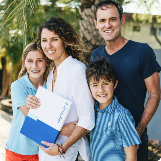 Smiling family holding their Trust & Will Estate Plan